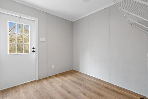 a view of an empty room with a window