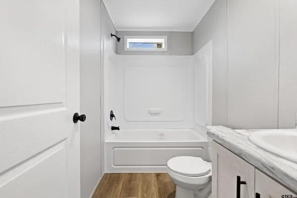 a view of a pathway both side of yard