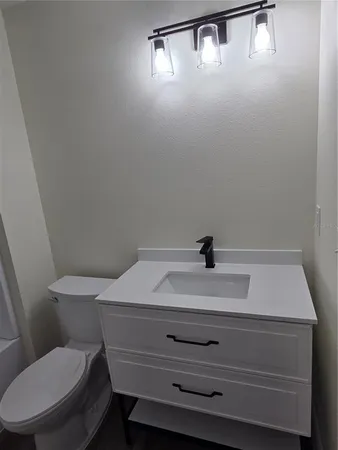 a bathroom with a toilet and a sink