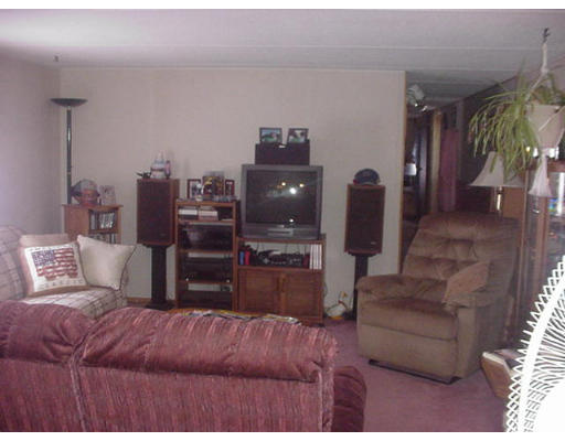 31 Longboat Road, Unit 31 Wareham, MA 02576 - Photo 4 of 14 a living room with furniture and a flat screen tv