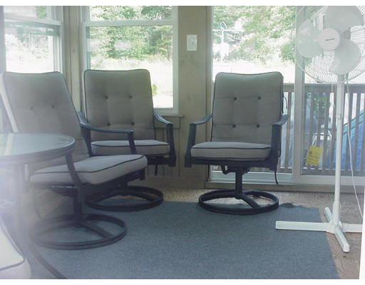 31 Longboat Road, Unit 31 Wareham, MA 02576 - Photo 8 of 14 a living room with furniture a window and a table