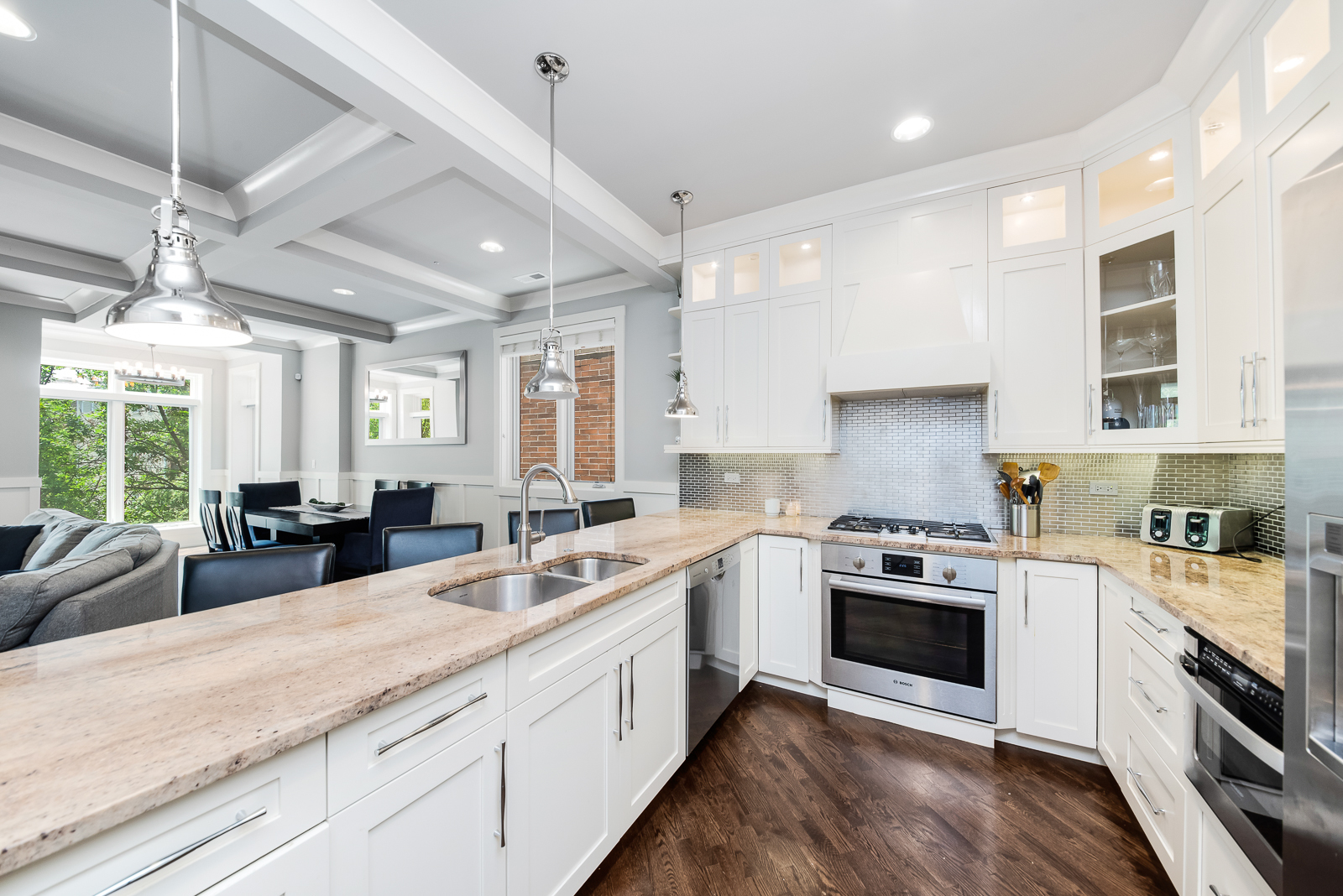 4029 South Ellis Avenue, Unit 3N Chicago, IL 60653 - Photo 7 of 19 a kitchen with stainless steel appliances granite countertop a sink a stove and a wooden floors