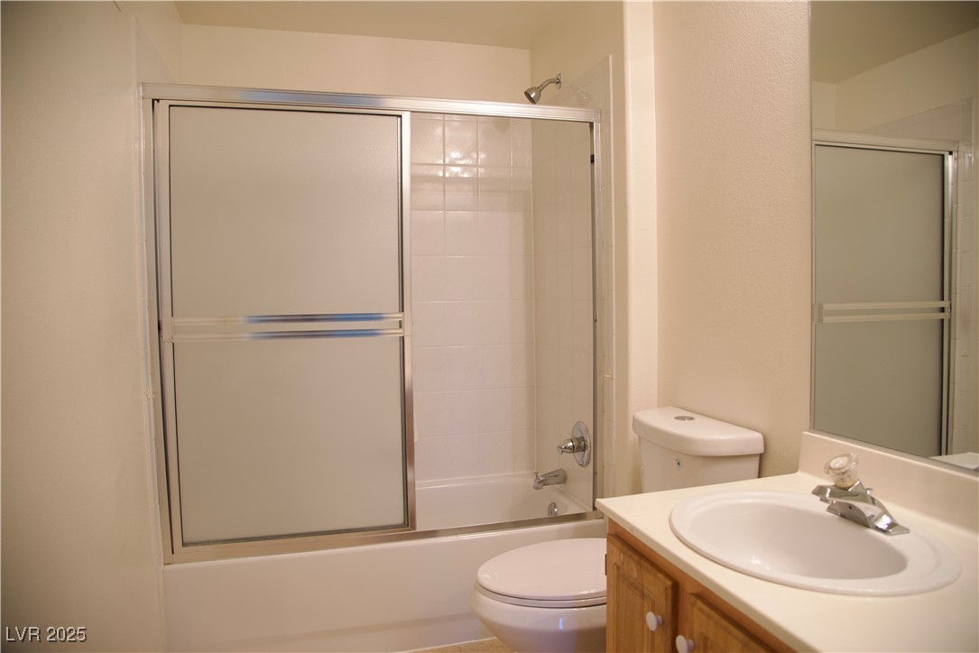 8555 West Russell Road, Unit 1078 Las Vegas, NV 89113 - Photo 26 of 34 Bathroom featuring vanity and bath / shower combo with glass door