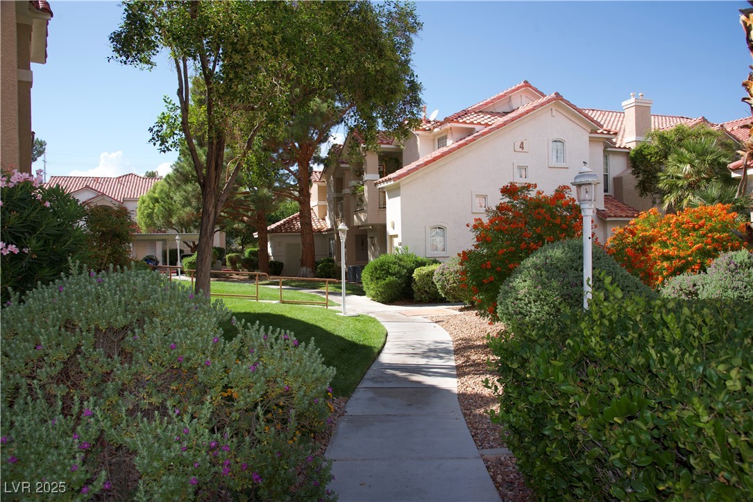 8555 West Russell Road, Unit 1078 Las Vegas, NV 89113 - Photo 34 of 34 View of property's community featuring a residential view and a lawn