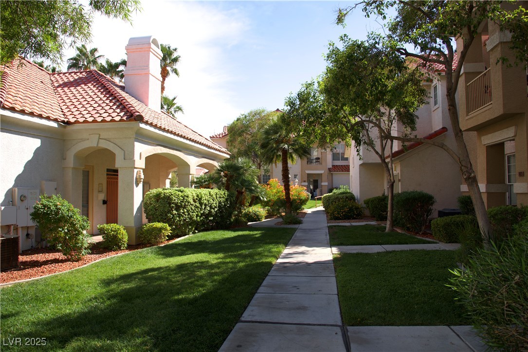 8555 West Russell Road, Unit 1078 Las Vegas, NV 89113 - Photo 5 of 34 View of community with a lawn and a residential view