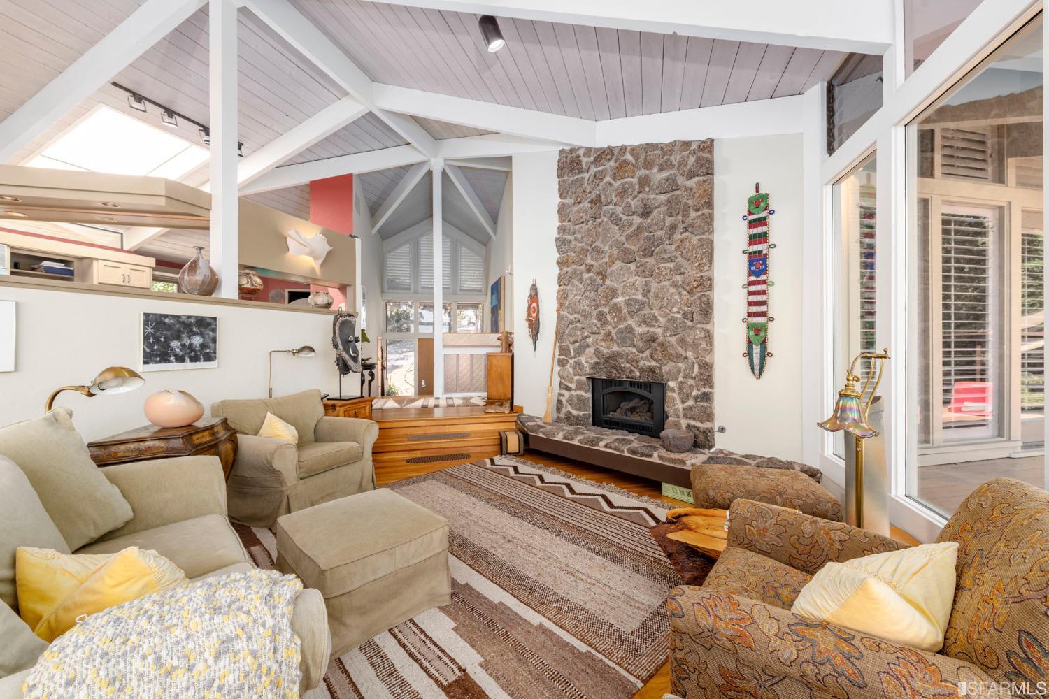 250 Hardwick Road Woodside, CA 94062 - Photo 19 of 50 a living room with furniture and a fireplace