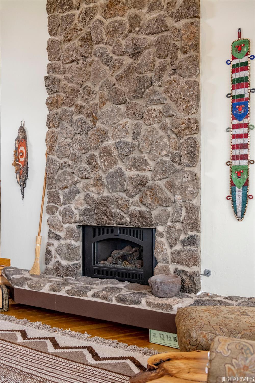 250 Hardwick Road Woodside, CA 94062 - Photo 20 of 50 a living room with a fireplace and a flat screen tv