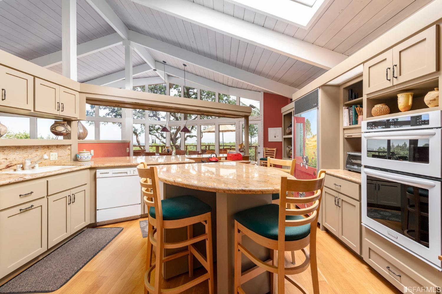 250 Hardwick Road Woodside, CA 94062 - Photo 26 of 50 a kitchen with a stove and white cabinets