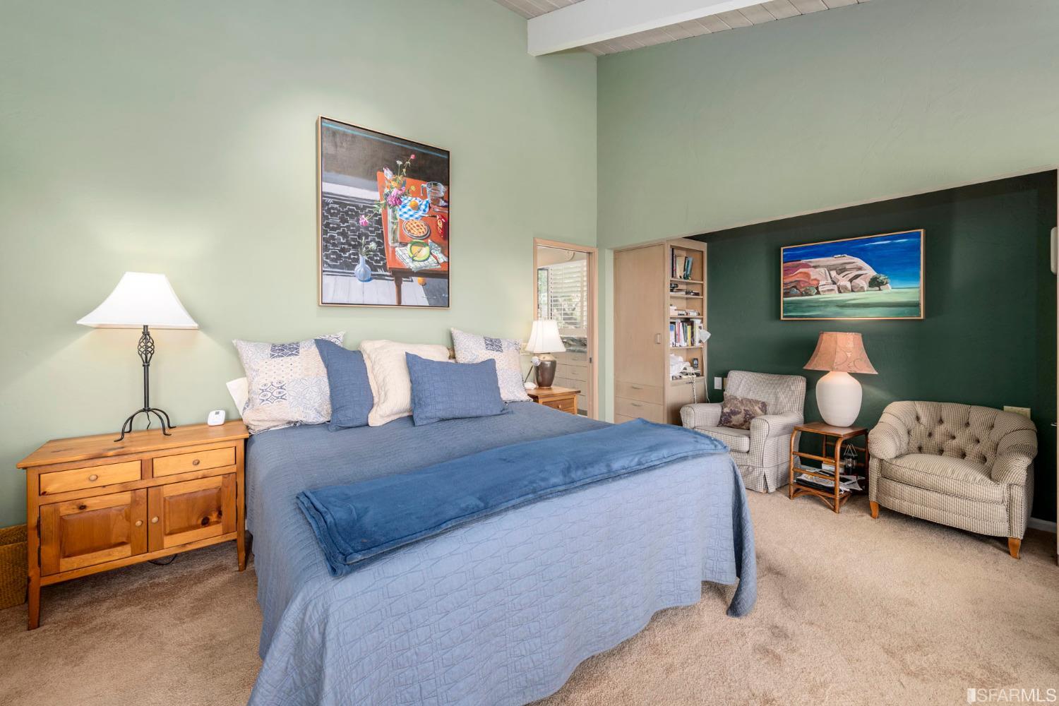 250 Hardwick Road Woodside, CA 94062 - Photo 35 of 50 a spacious bedroom with a bed and a couch