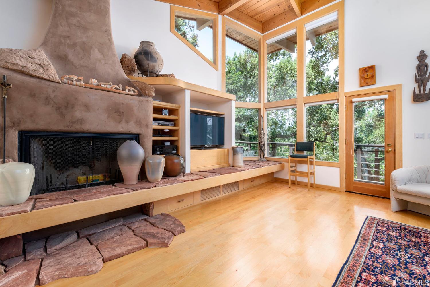 250 Hardwick Road Woodside, CA 94062 - Photo 48 of 50 a living room with furniture large window and a fireplace