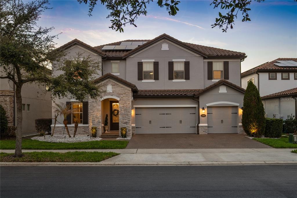 10950 Lemon Lake Boulevard Orlando, FL 32836 - Photo 1 of 53 a front view of a house with a yard