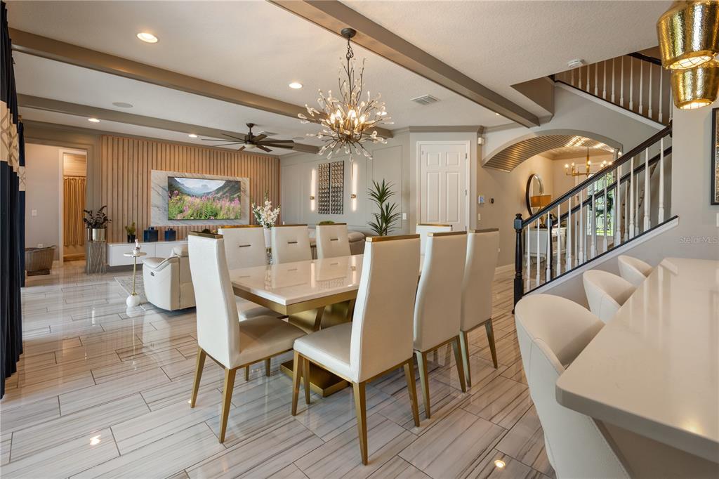10950 Lemon Lake Boulevard Orlando, FL 32836 - Photo 13 of 53 a view of a dining room with furniture and a chandelier