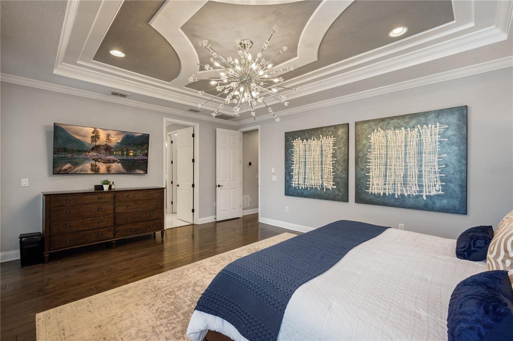 10950 Lemon Lake Boulevard Orlando, FL 32836 - Photo 19 of 53 a spacious bedroom with a bed and a flat screen tv