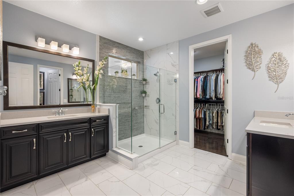 10950 Lemon Lake Boulevard Orlando, FL 32836 - Photo 21 of 53 a spacious bathroom with a shower sink and mirror