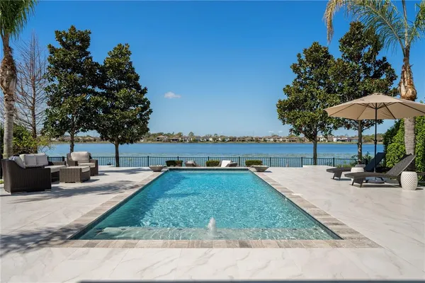 a view of a swimming pool with a patio