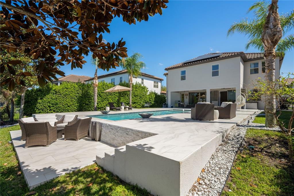 10950 Lemon Lake Boulevard Orlando, FL 32836 - Photo 39 of 53 a view of a house with backyard and a tree