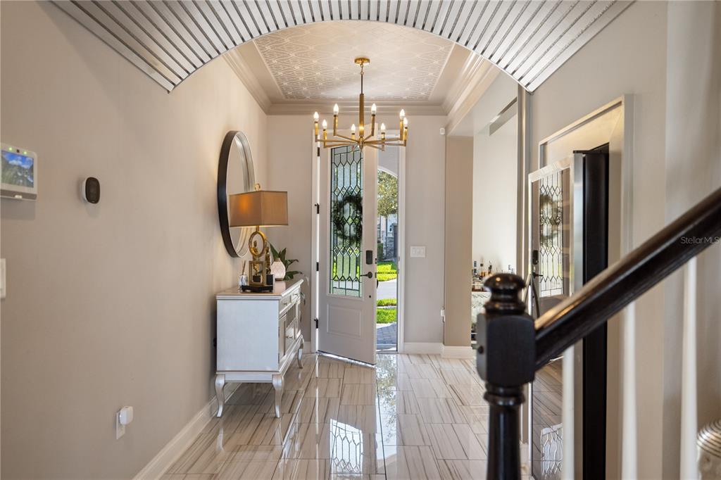 10950 Lemon Lake Boulevard Orlando, FL 32836 - Photo 4 of 53 a view of a hallway with furniture and chandelier