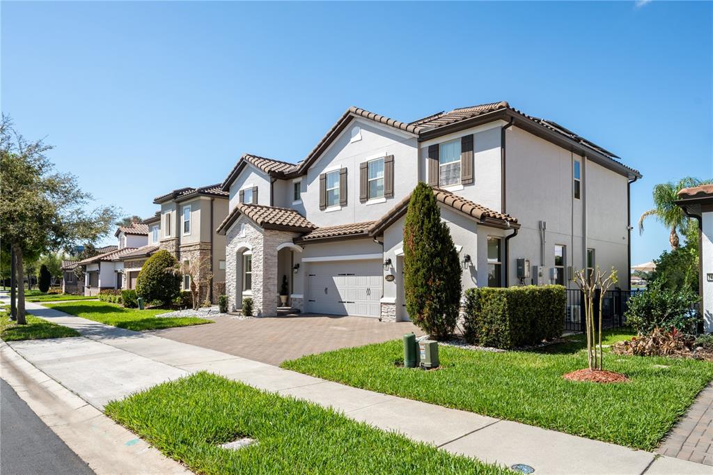10950 Lemon Lake Boulevard Orlando, FL 32836 - Photo 50 of 53 a front view of a house with a yard and garage