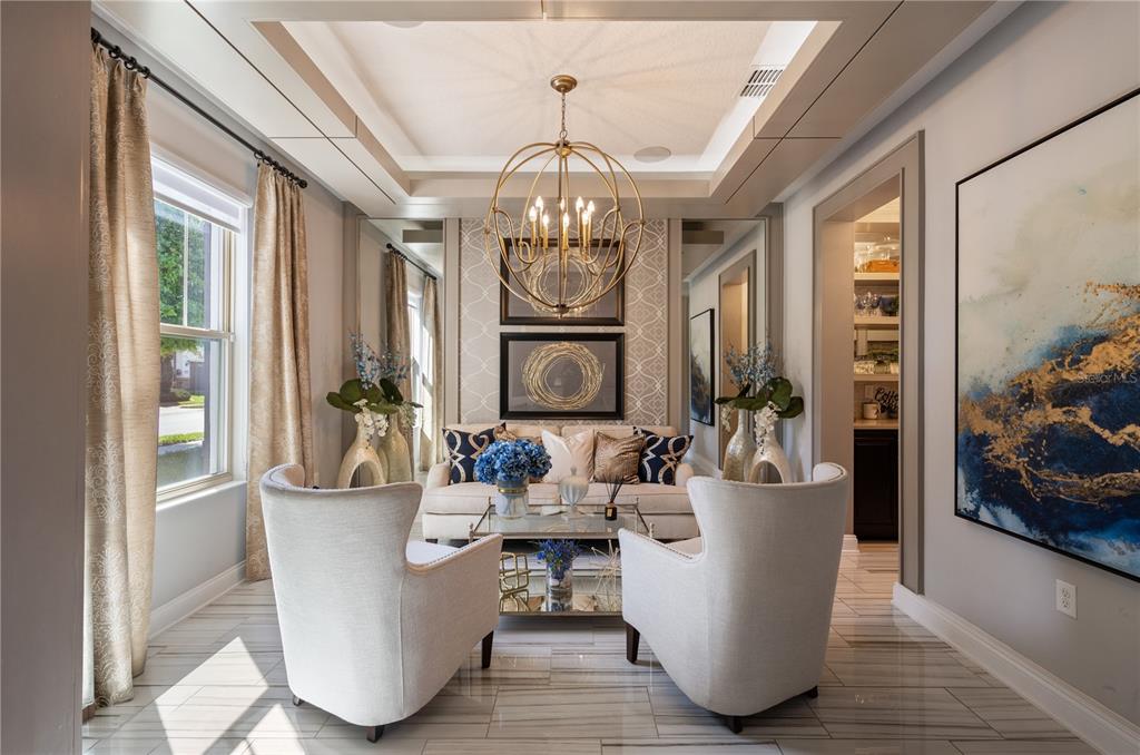 10950 Lemon Lake Boulevard Orlando, FL 32836 - Photo 5 of 53 a dining room with wooden floor and chandelier