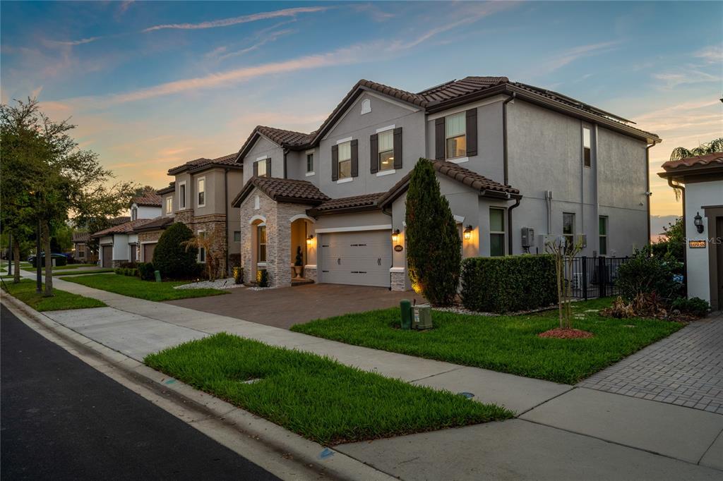 10950 Lemon Lake Boulevard Orlando, FL 32836 - Photo 51 of 53 a front view of a house with a yard and garage
