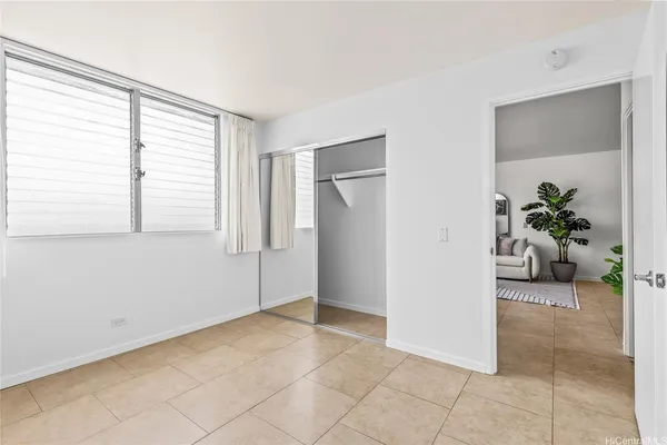 a view of an empty room with a window