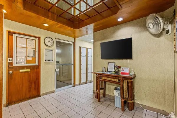 a view of a bathroom with shower and windows