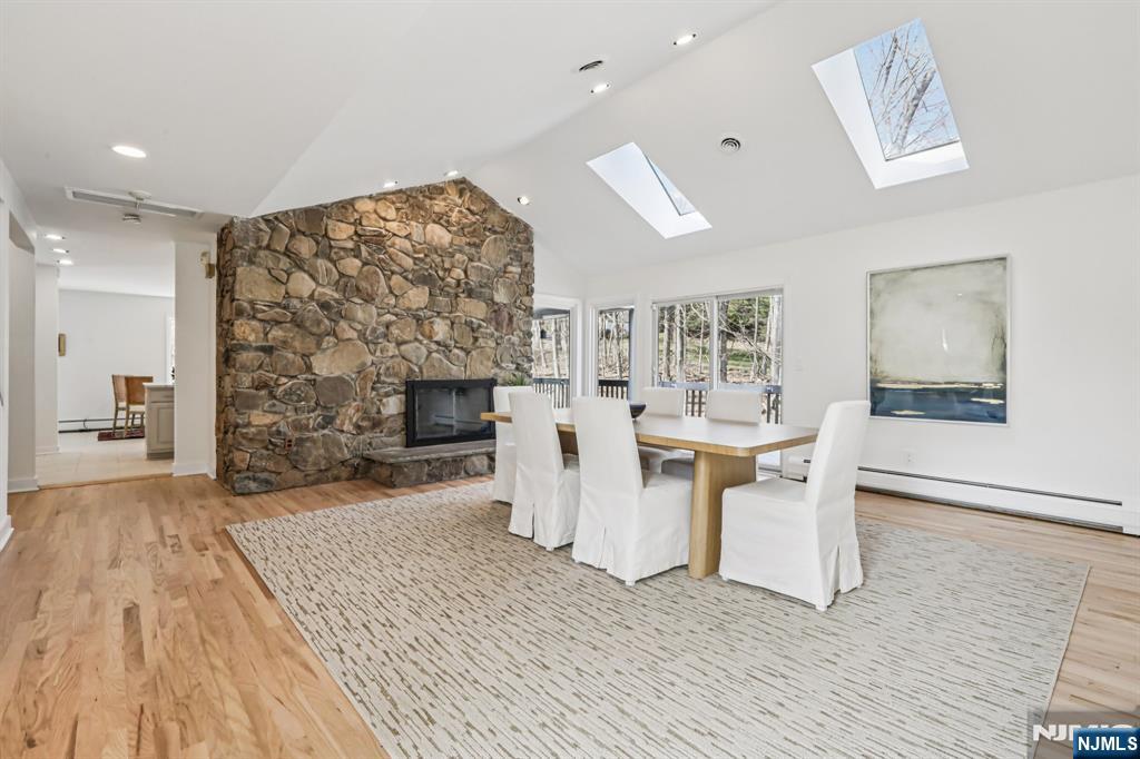 11 Carlough Road Upper Saddle River, NJ 07458 - Photo 12 of 41 a living room with furniture a fireplace and a flat screen tv