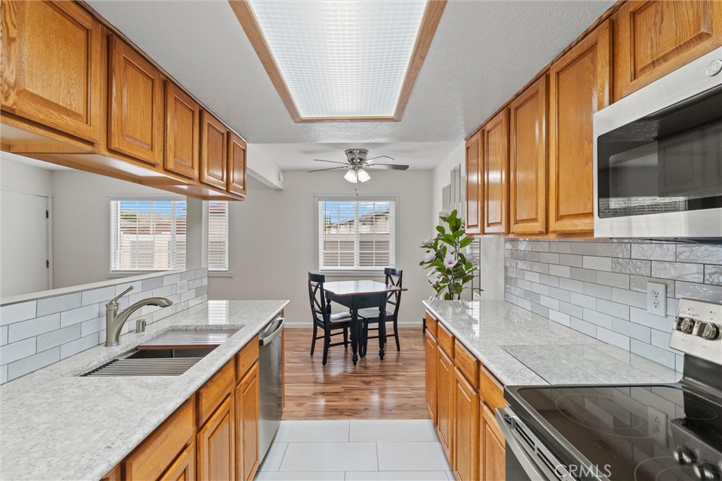 20800 Plum Canyon Road Saugus, CA 91350 - Photo 11 of 26 a kitchen with a sink stove and cabinets