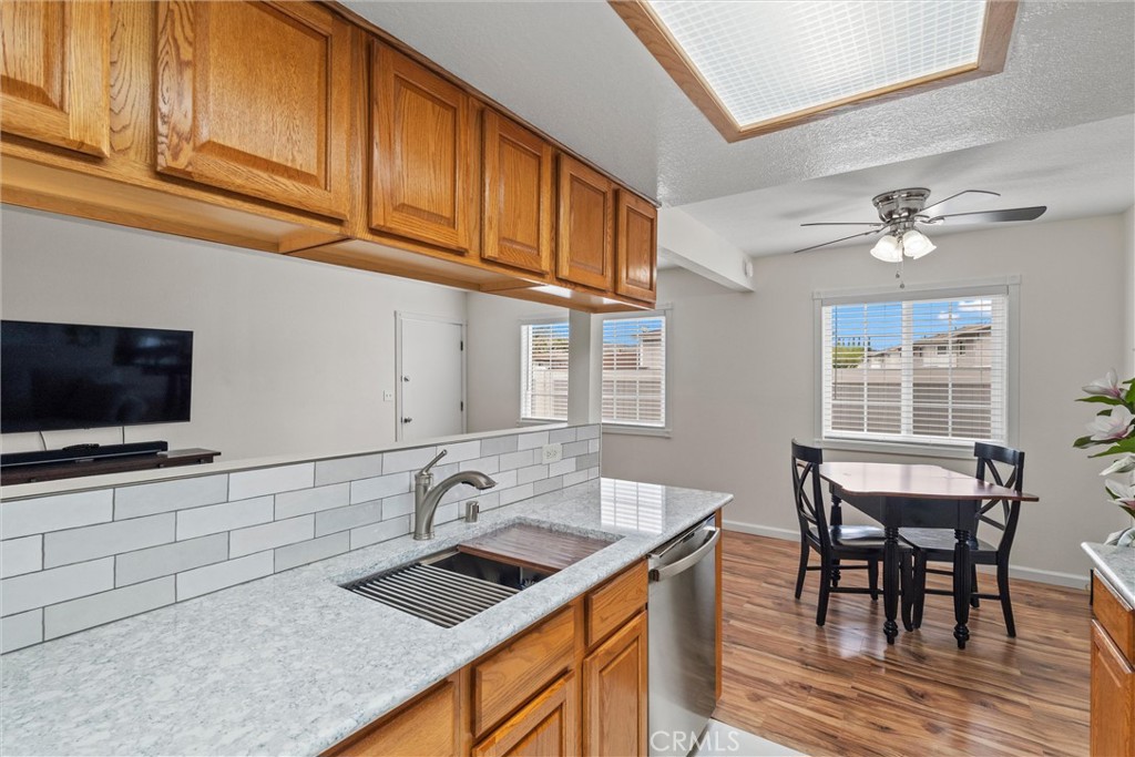 20800 Plum Canyon Road Saugus, CA 91350 - Photo 12 of 26 a kitchen with stainless steel appliances granite countertop a sink and cabinets