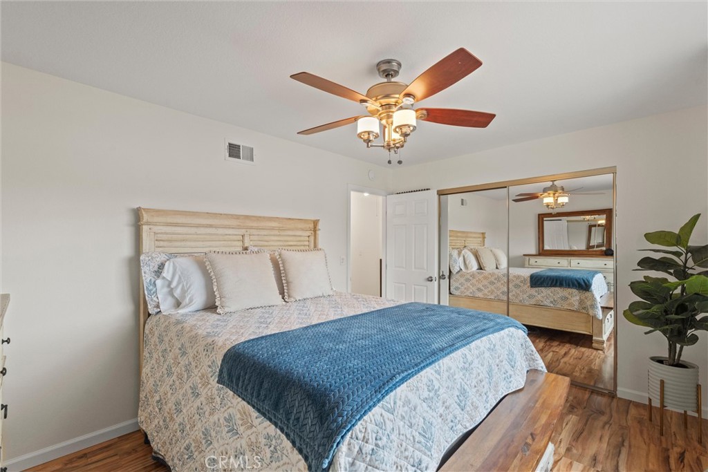 20800 Plum Canyon Road Saugus, CA 91350 - Photo 17 of 26 a bedroom with a bed and a chandelier