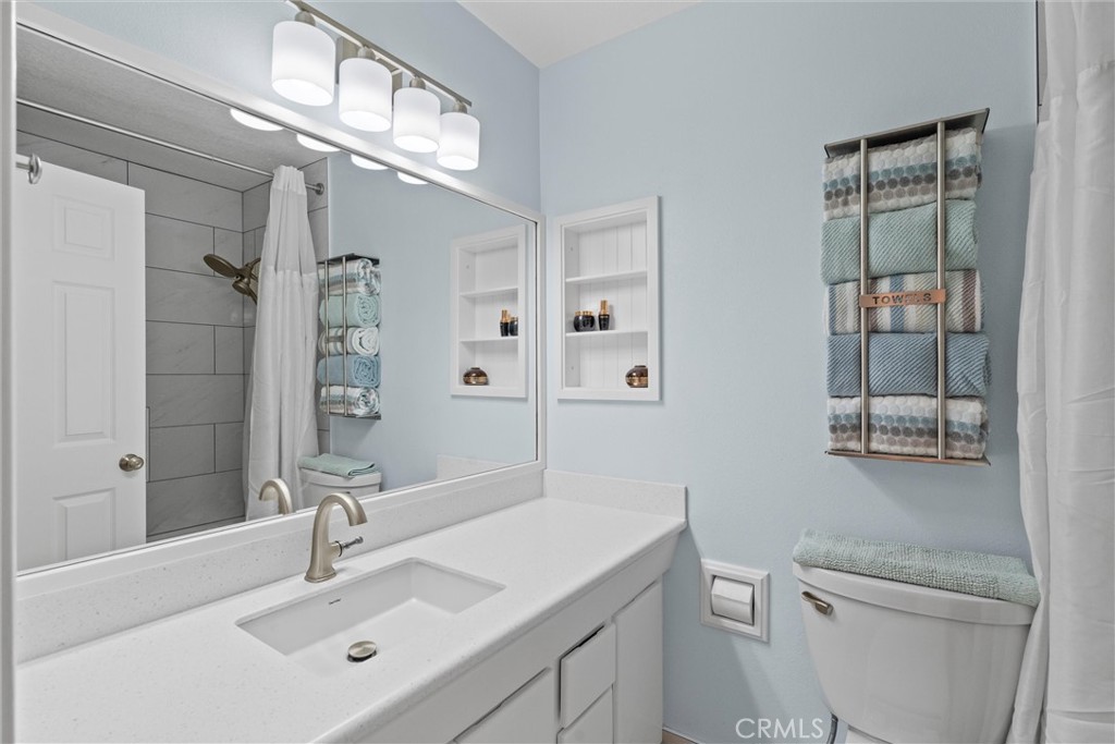20800 Plum Canyon Road Saugus, CA 91350 - Photo 19 of 26 a bathroom with a sink a toilet and shower