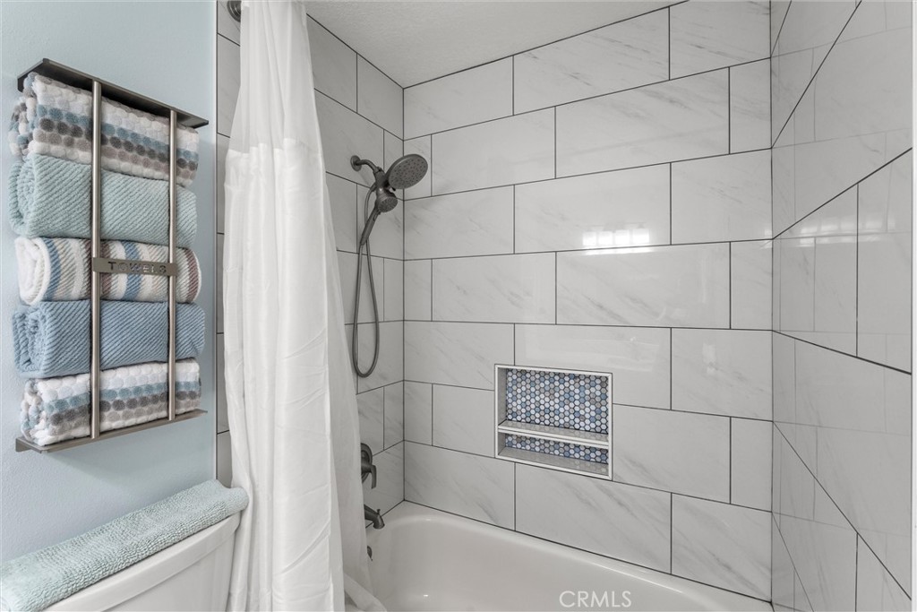 20800 Plum Canyon Road Saugus, CA 91350 - Photo 20 of 26 a bathroom with a shower and a bathtub