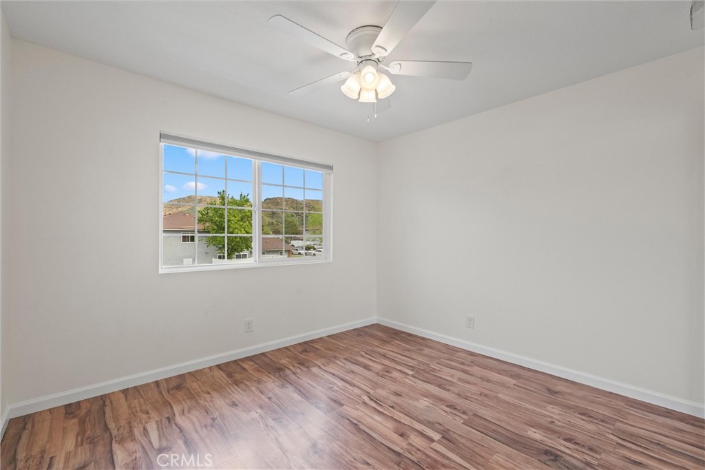 20800 Plum Canyon Road Saugus, CA 91350 - Photo 21 of 26 wooden floor in an empty room with a window