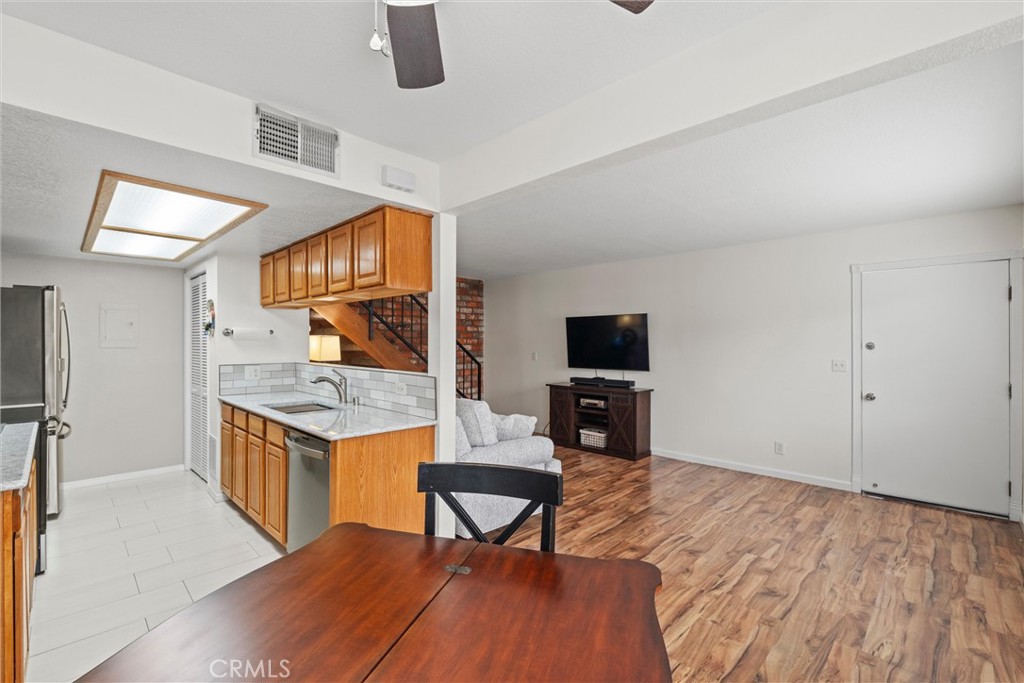 20800 Plum Canyon Road Saugus, CA 91350 - Photo 8 of 26 a living room with granite countertop furniture a flat screen tv and kitchen view