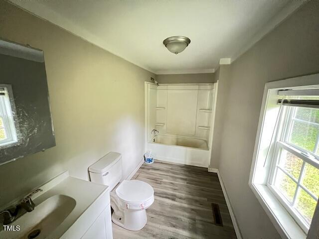 7710 Leasburg Road Roxboro, NC 27574 - Photo 17 of 24 a bathroom with a sink mirror vanity and a toilet