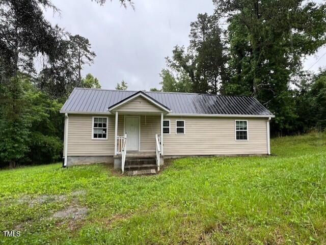 7710 Leasburg Road Roxboro, NC 27574 - Photo 2 of 24 a front view of a house with yard