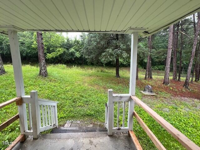 7710 Leasburg Road Roxboro, NC 27574 - Photo 4 of 24 a view of a small yard from a balcony
