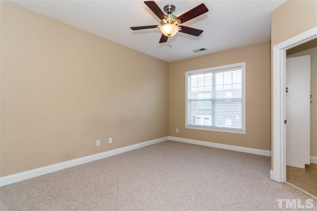 610 Highpark Lane Raleigh, NC 27608 - Photo 15 of 25 an empty room with a window and a fan