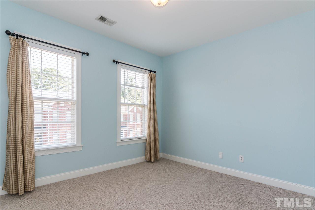 610 Highpark Lane Raleigh, NC 27608 - Photo 19 of 25 an empty room with windows