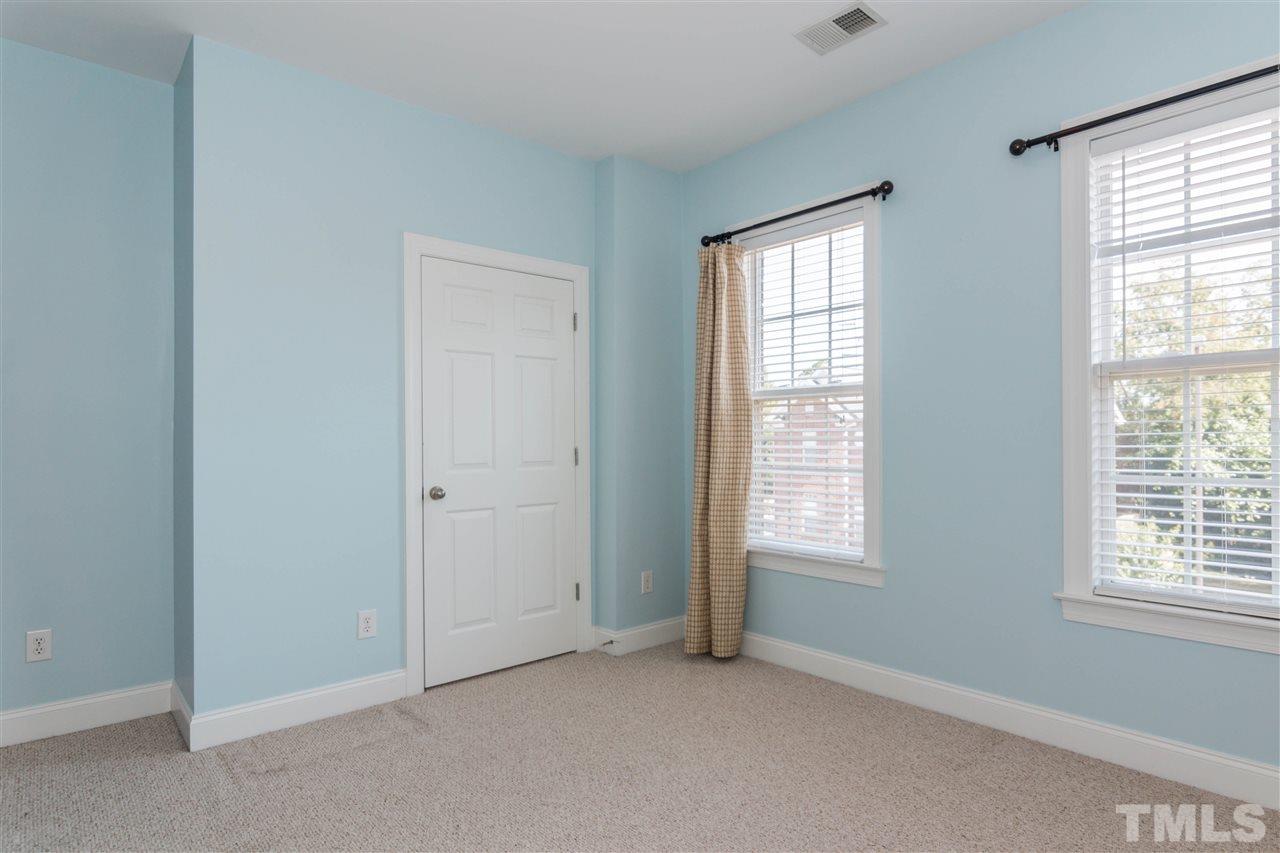 610 Highpark Lane Raleigh, NC 27608 - Photo 20 of 25 an empty room with windows