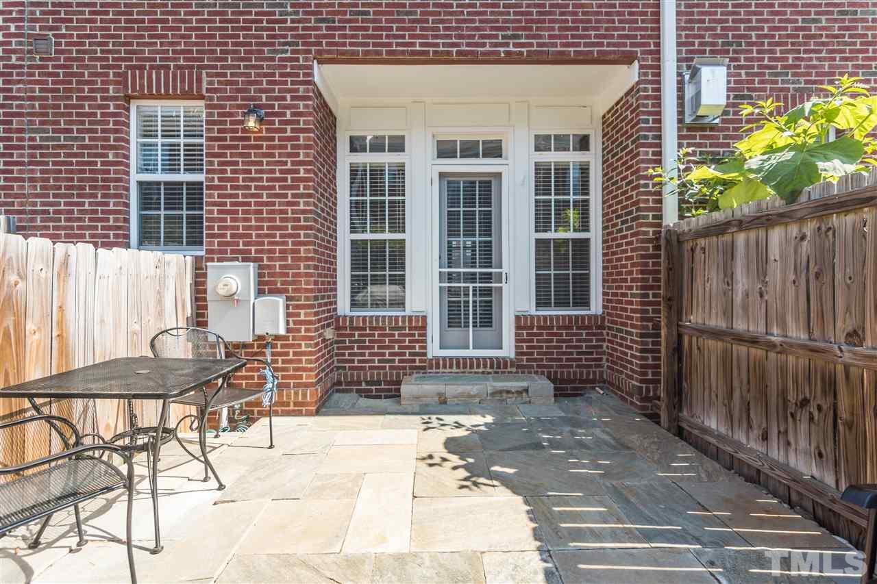 610 Highpark Lane Raleigh, NC 27608 - Photo 22 of 25 a front view of a house with outdoor seating
