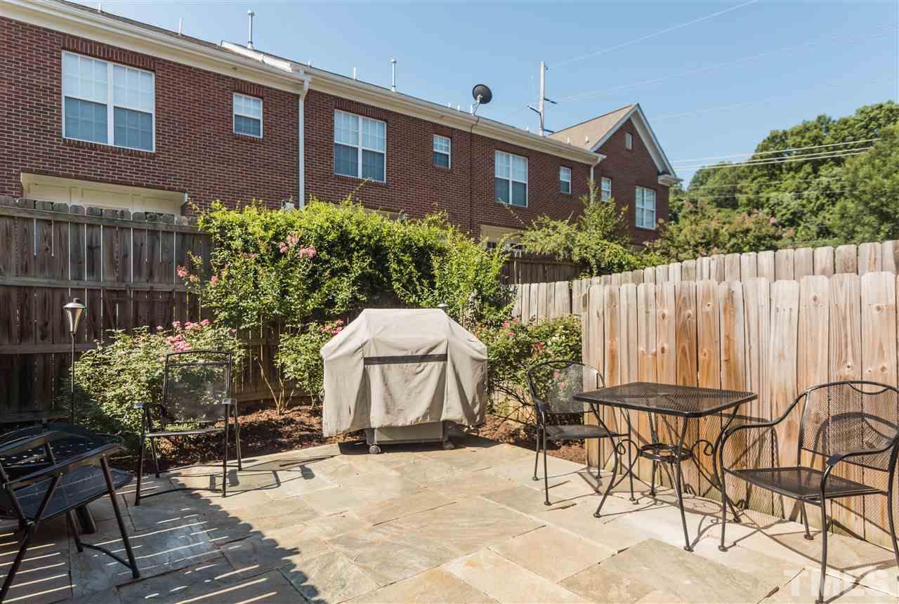 610 Highpark Lane Raleigh, NC 27608 - Photo 23 of 25 a view of a chairs and table in patio