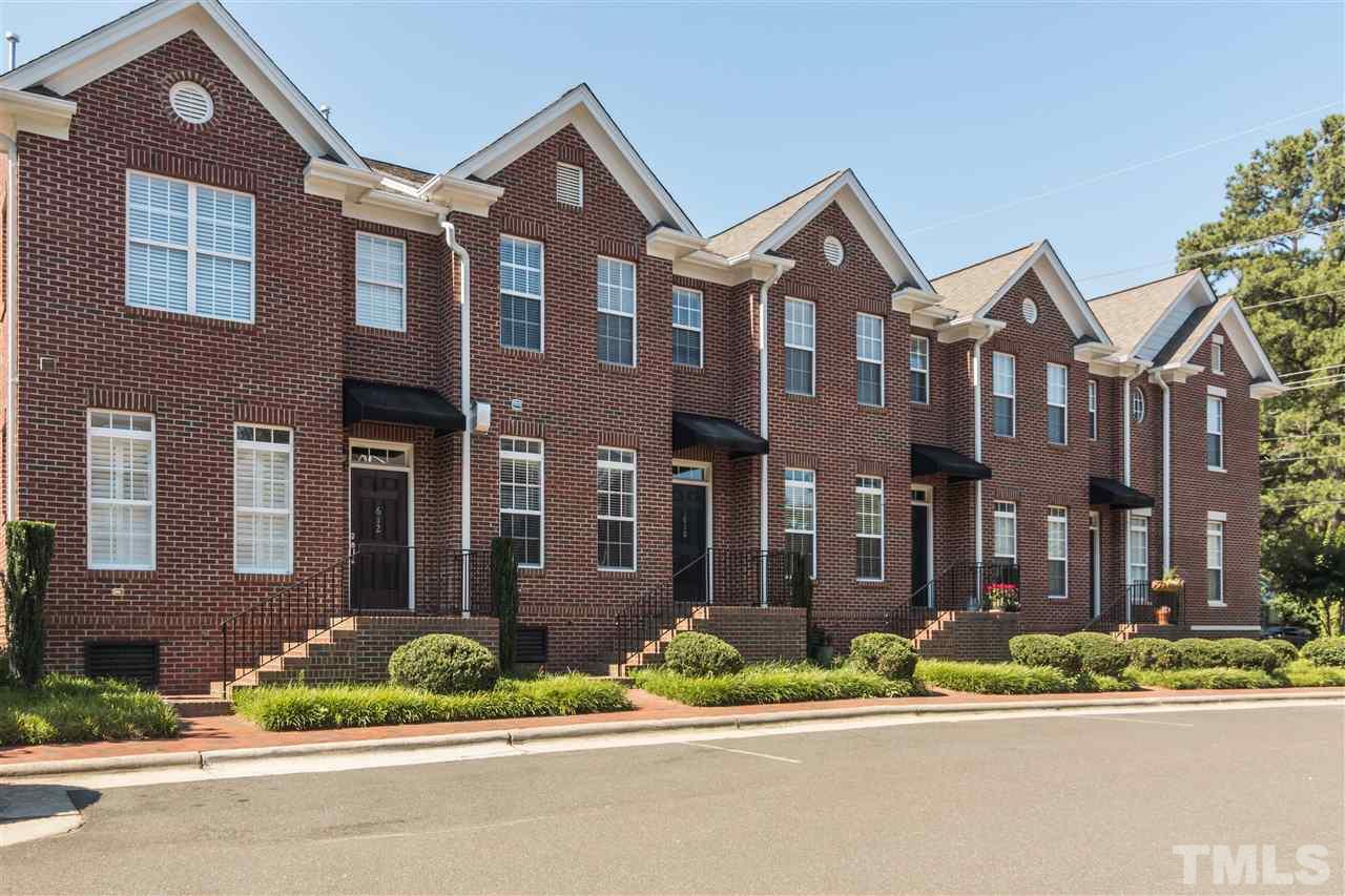 610 Highpark Lane Raleigh, NC 27608 - Photo 25 of 25 a front view of a building with a yard