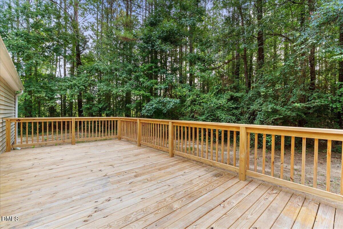 25 Green Pastures Road Louisburg, NC 27549 - Photo 20 of 20 massive deck leading to the backyard