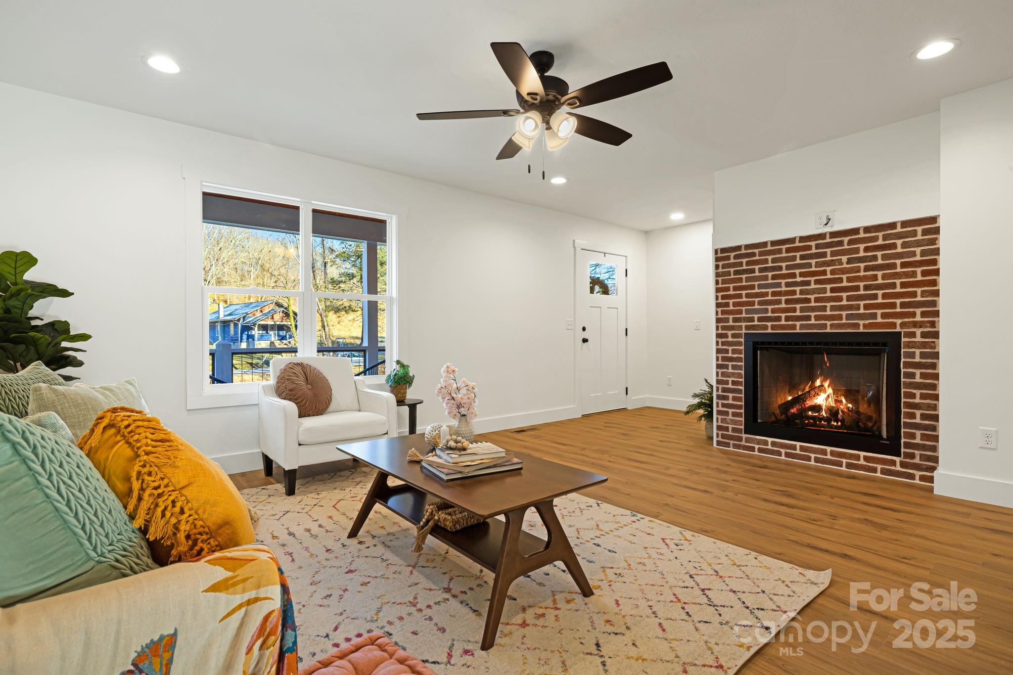 386 Holtzclaw Street Canton, NC 28716 - Photo 14 of 43 a living room with furniture and a fireplace