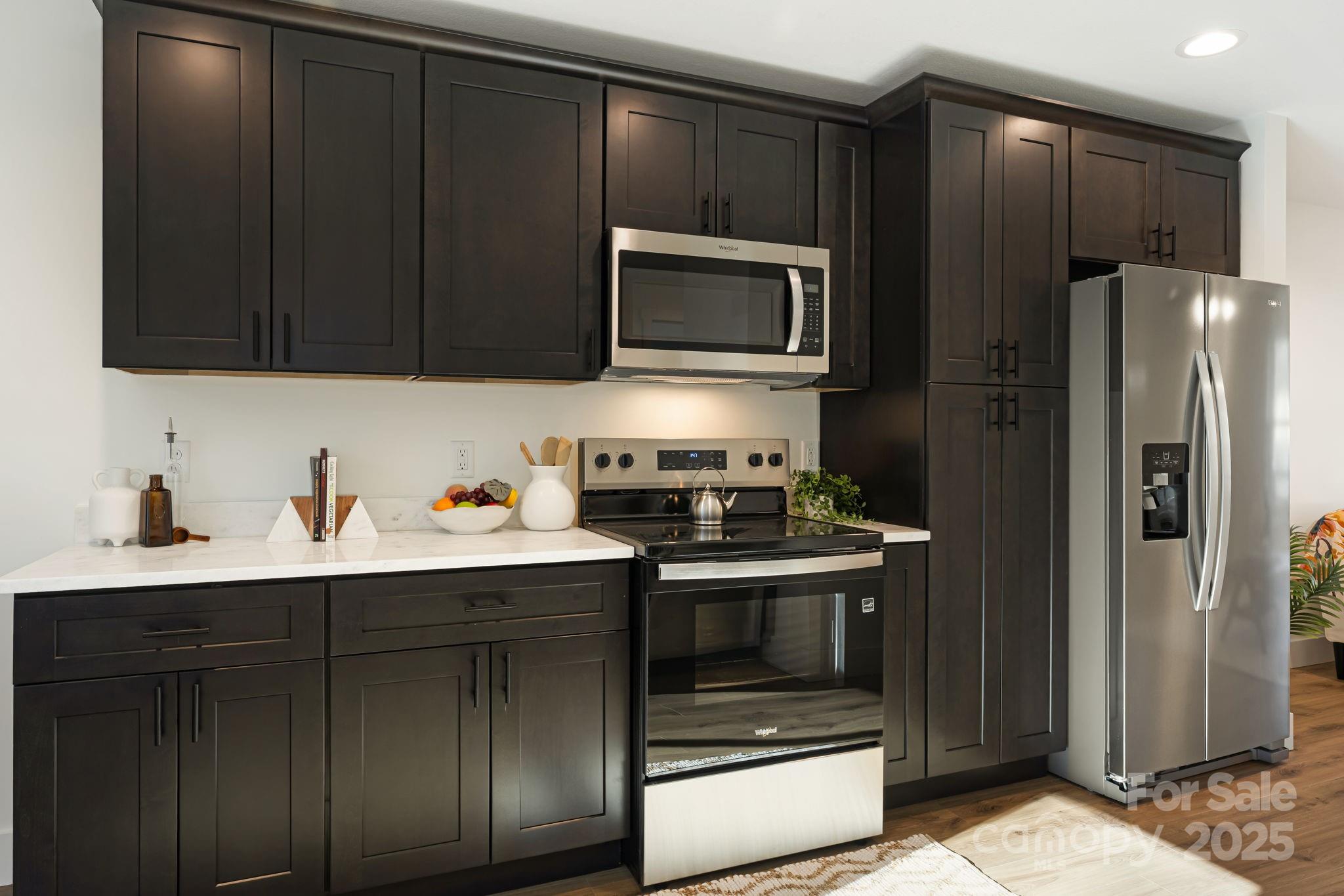 386 Holtzclaw Street Canton, NC 28716 - Photo 20 of 43 a kitchen with a sink stove and refrigerator