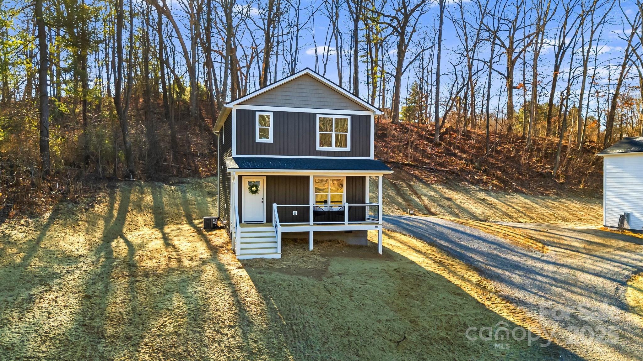 386 Holtzclaw Street Canton, NC 28716 - Photo 2 of 43 a front view of a house with a yard