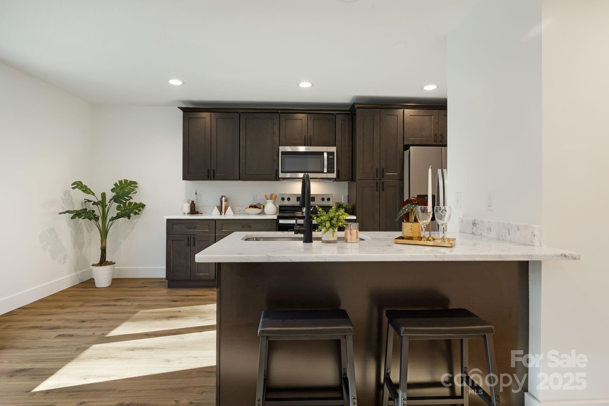 386 Holtzclaw Street Canton, NC 28716 - Photo 21 of 43 a kitchen with a sink and cabinets