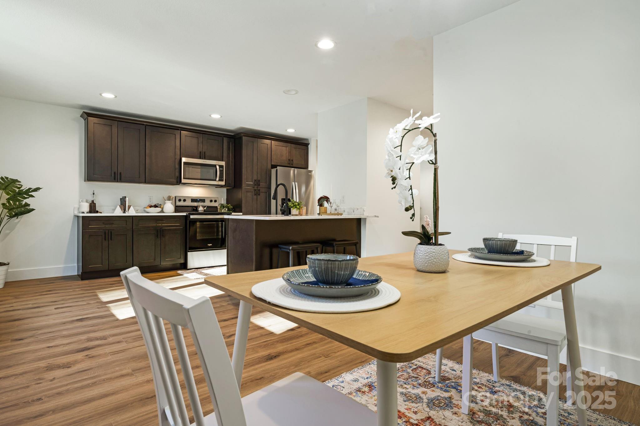 386 Holtzclaw Street Canton, NC 28716 - Photo 22 of 43 a kitchen with a dining table and chairs