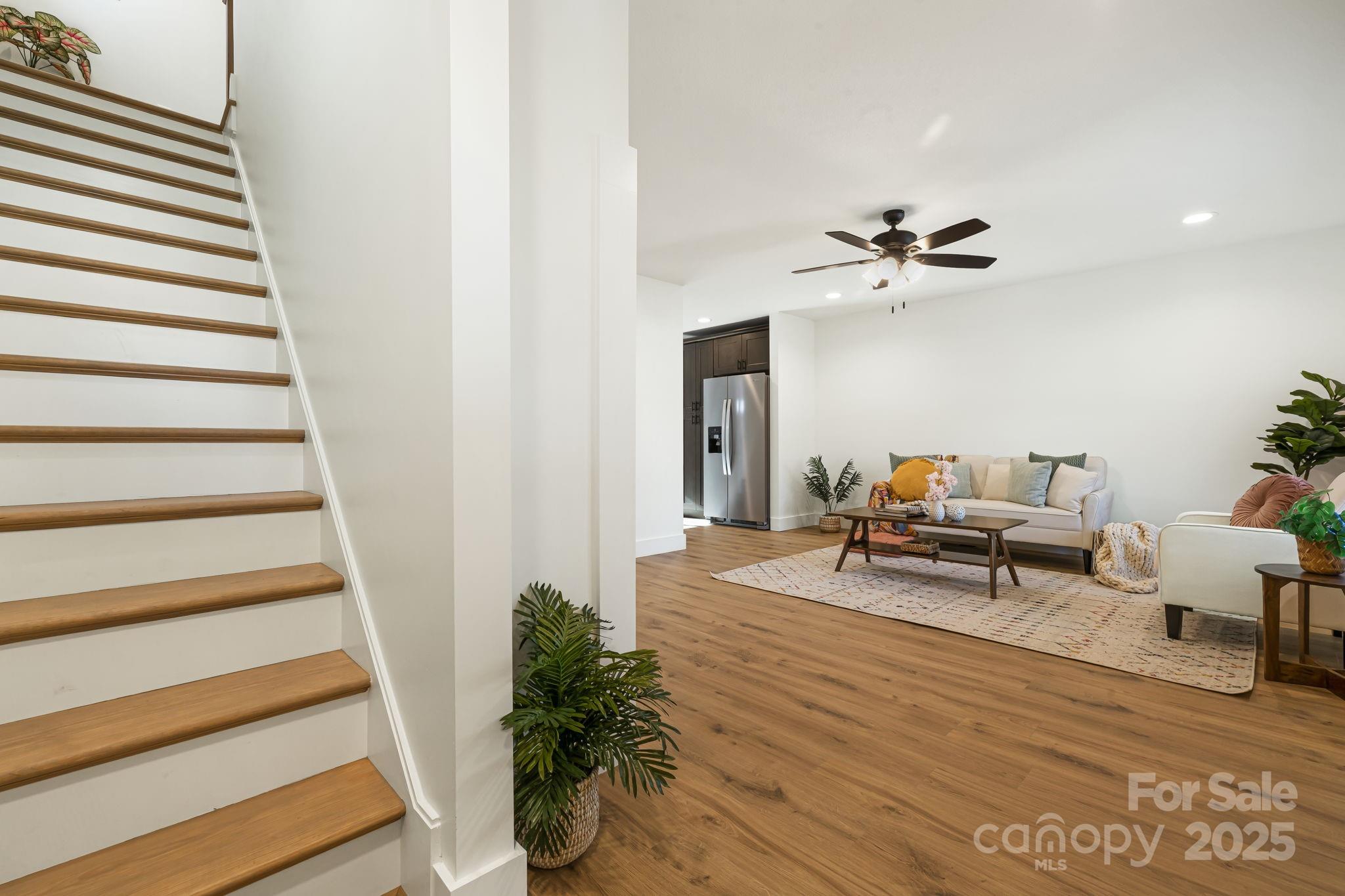 386 Holtzclaw Street Canton, NC 28716 - Photo 26 of 43 a living room with furniture and a potted plant